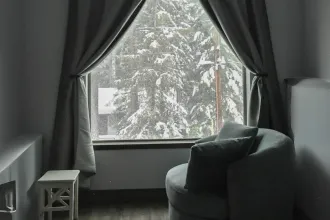 Looking out a snowy window from the living room, representing God who cares about His people. 