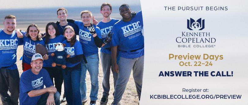 Group of college students in a field, smiling