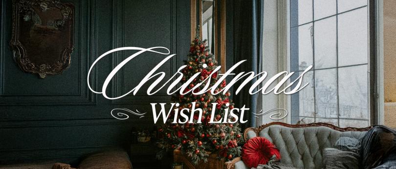 Decorated Christmas tree with red bows and ornaments beside a window and vintage sofa.