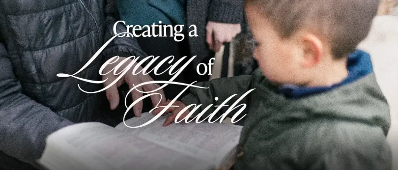 Adult and child touching an open Bible together, symbolizing family traditions that nurture spiritual growth and build a strong legacy of faith.